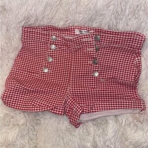 Plaid red/white shorts.
Size 5